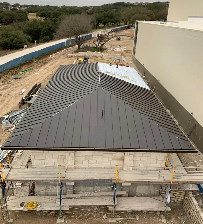 Metal roof new construction with scaffolding in Schroeppel